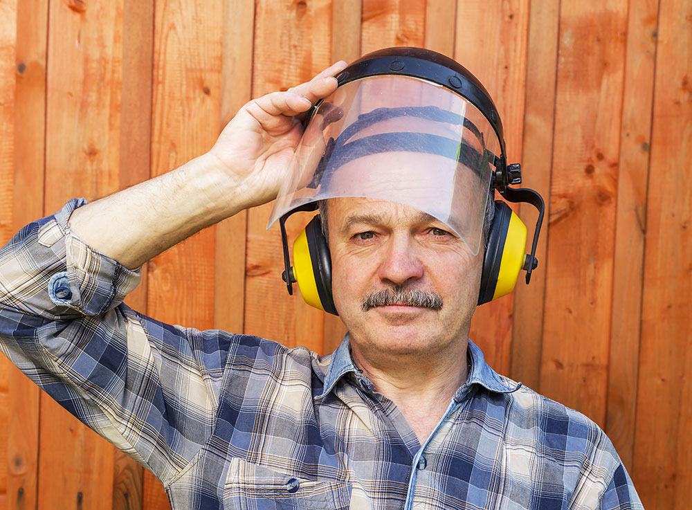 blue collar worker wearing hearing protection