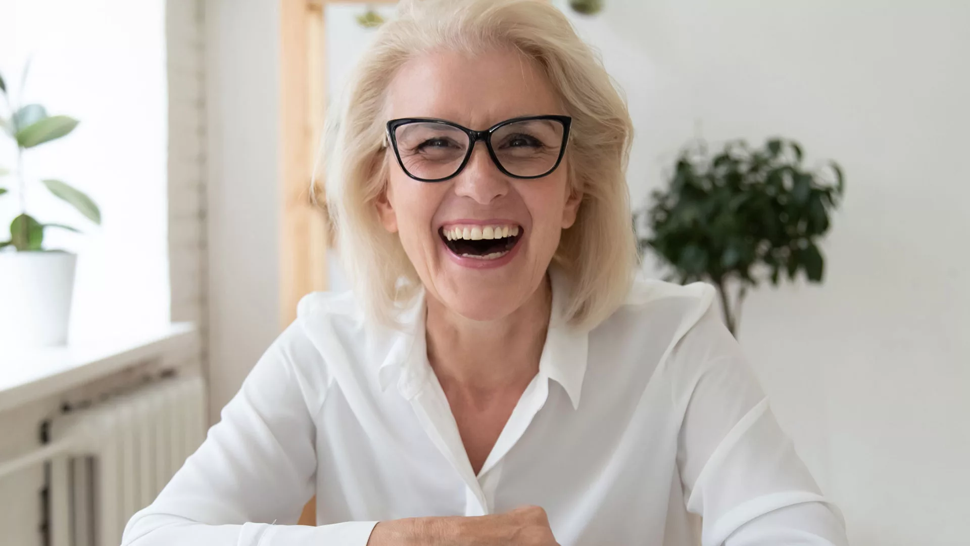 Happy woman with glasses smiling